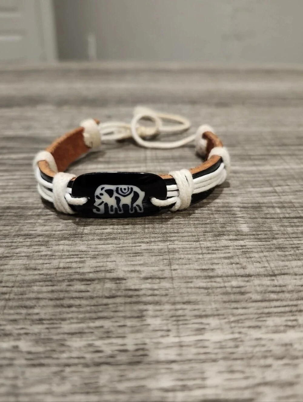 Brown And White Leather Bracelet W Black Elephant Bead And Adjustable Slide Bolo